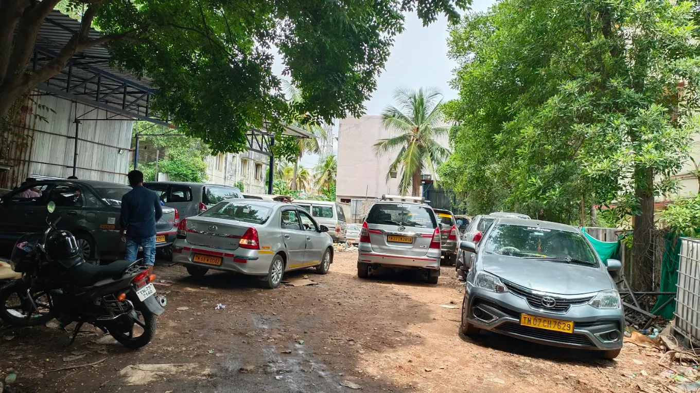 Several Toyota cars lined up in the workshop yard in Madipakkam